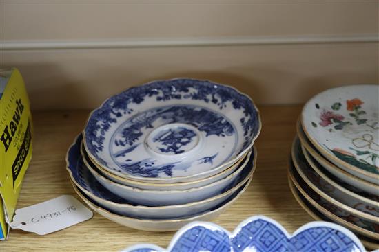 A group of 18th/19th century Chinese famille rose and blue and white saucers dishes tallest 23cm